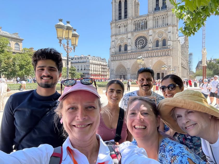 A LetzGo guide in Paris with the group in front of Notre-Dame