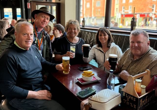 A LetzGo group with pints of Guinness in a Dublin pub